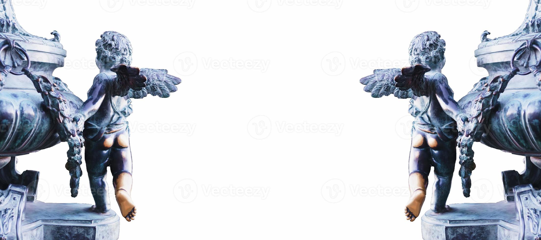 Two statues of Cupid made of metal on the edges on a white background. photo