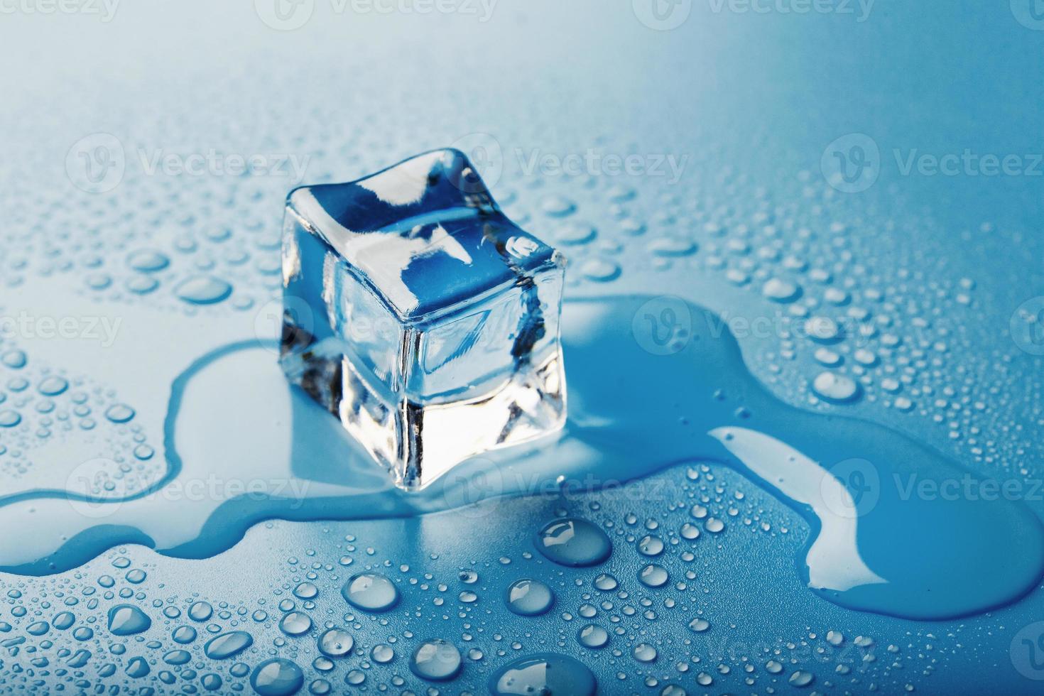 Blocks of Ice With water Drops close-up. Macro ice refreshing cube for a drink on a hot day photo