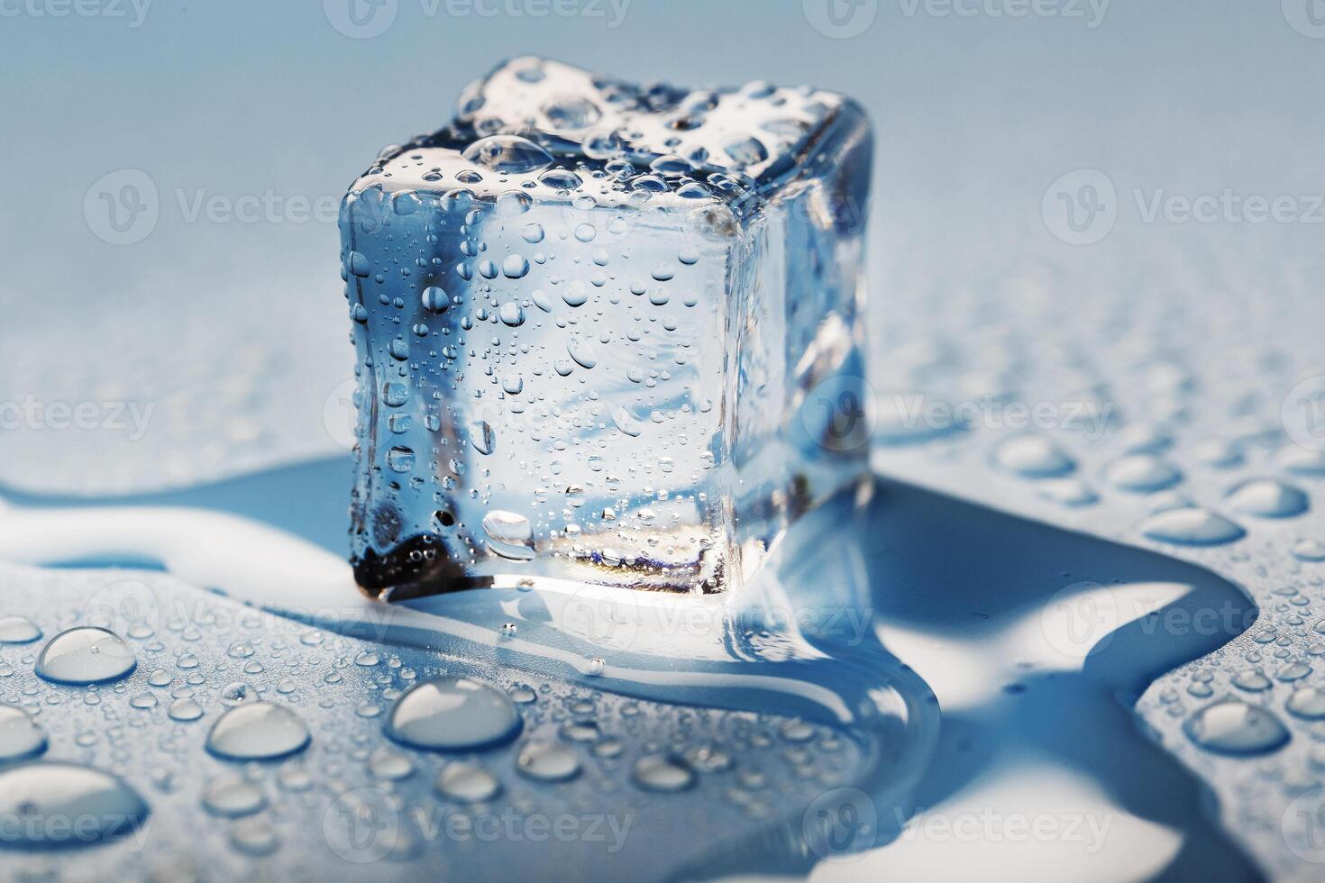 Blocks of Ice With water Drops close-up. Macro ice refreshing cube for a drink on a hot day photo