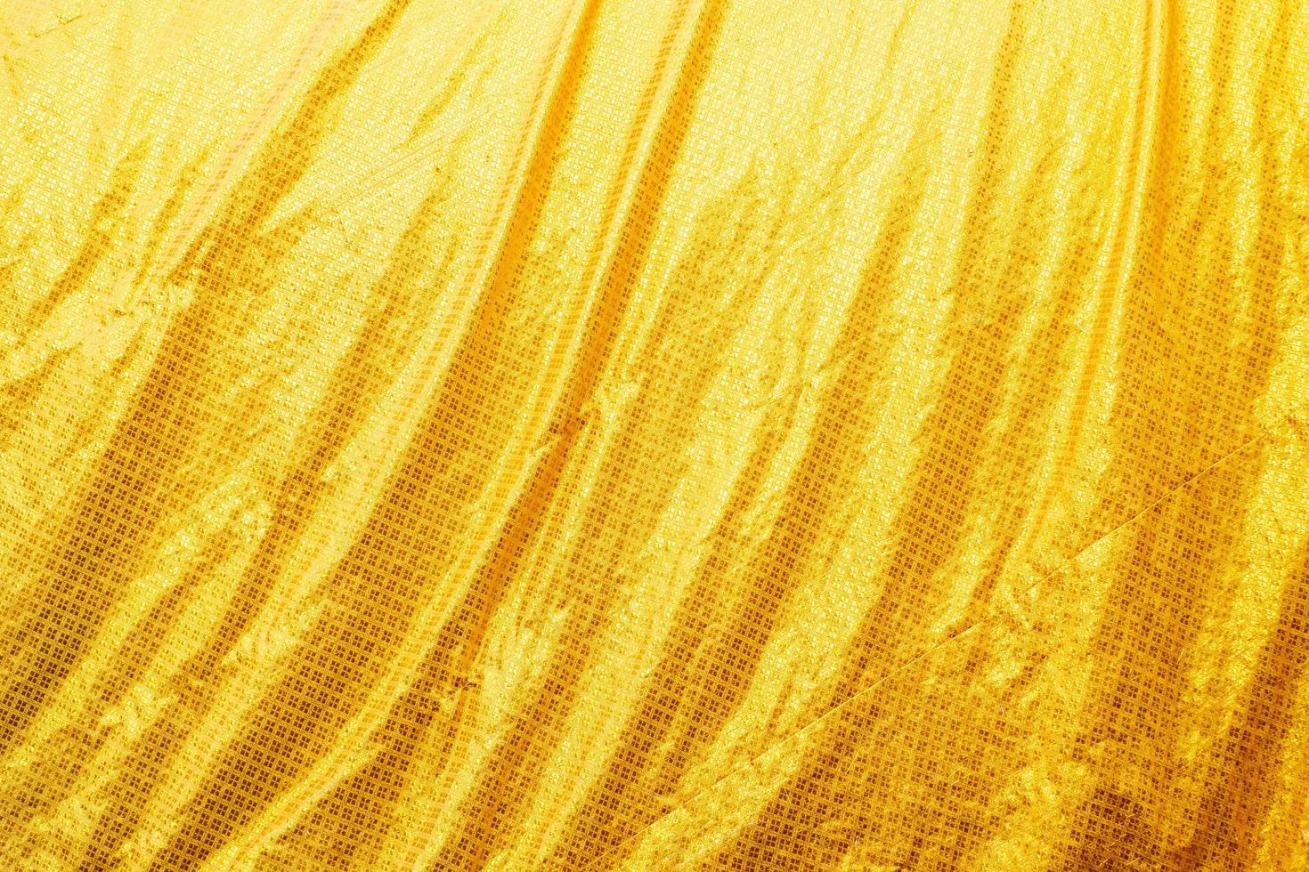 textura de gradiente de ropa de cama amarilla estilo de curva borrosa de tela de lujo abstracta, ropa de cama arrugada y sombras doradas, fondo foto