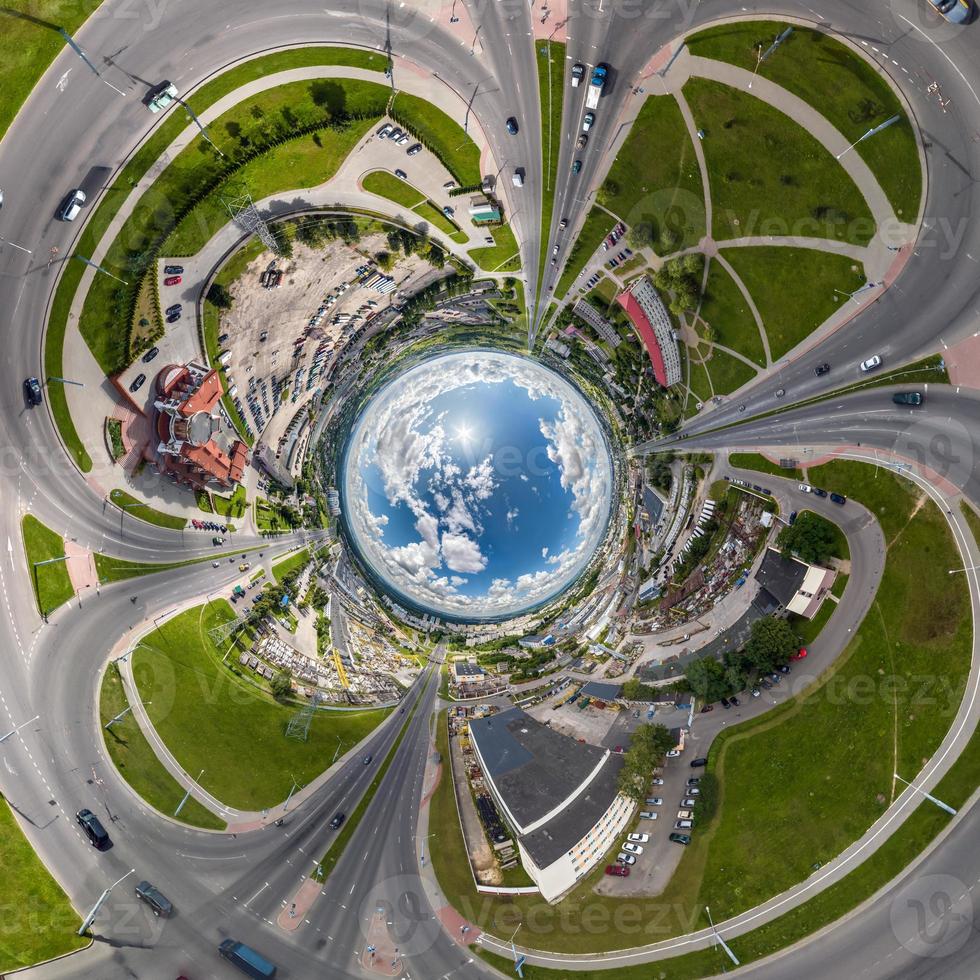 blue sphere inside overlooking old town, urban development, historic buildings and crossroads with cars. Transformation of spherical 360 panorama in abstract aerial view. photo
