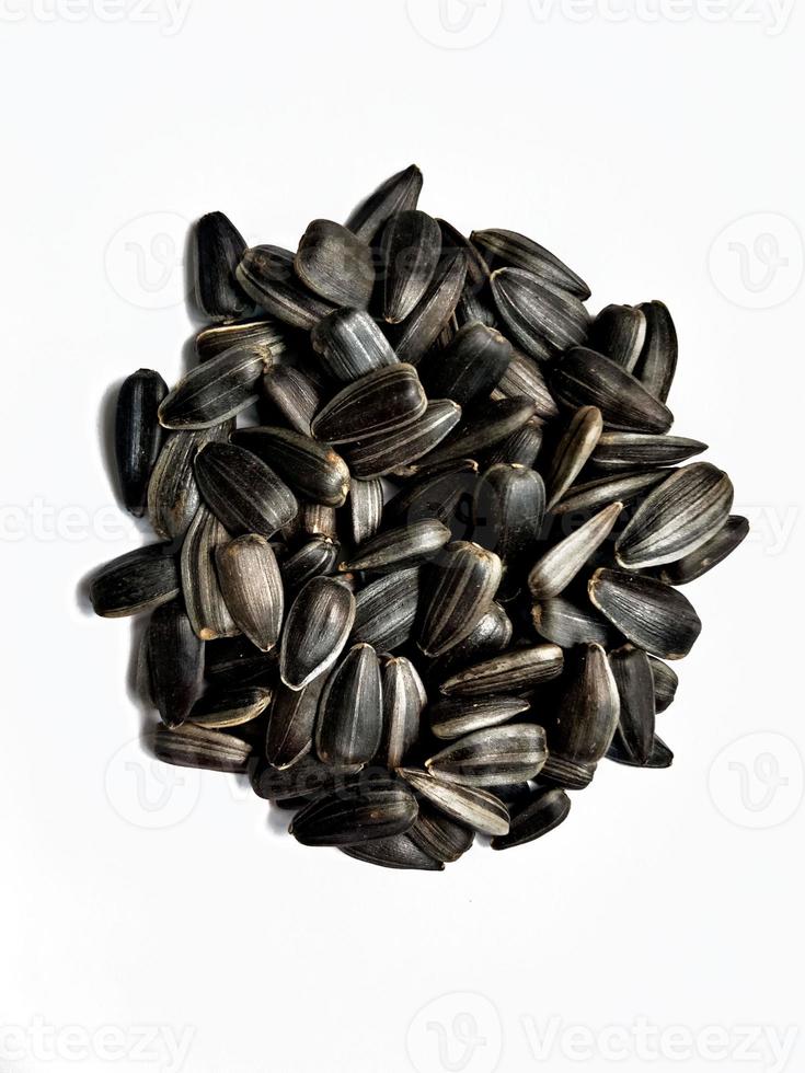 Tasty sunflower seeds isolated on a white background photo