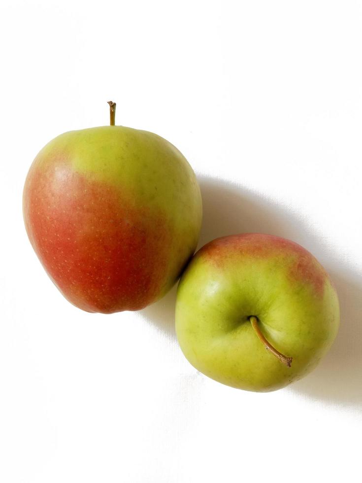 red-green apples on white background photo