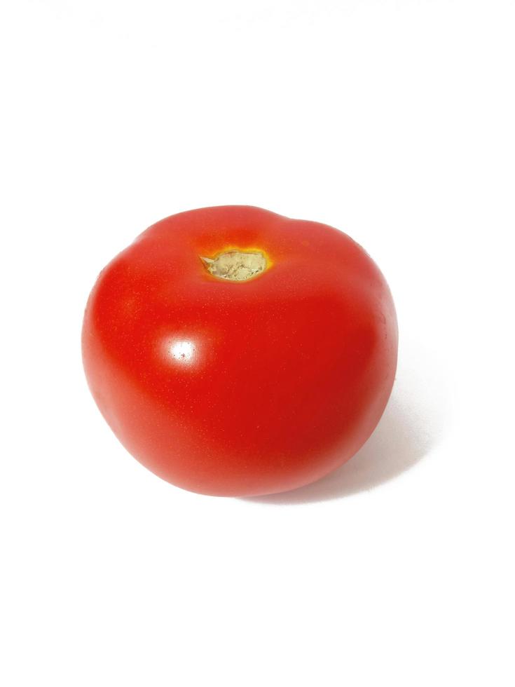 red fresh tomato on white background. Ingredients for cooking. photo