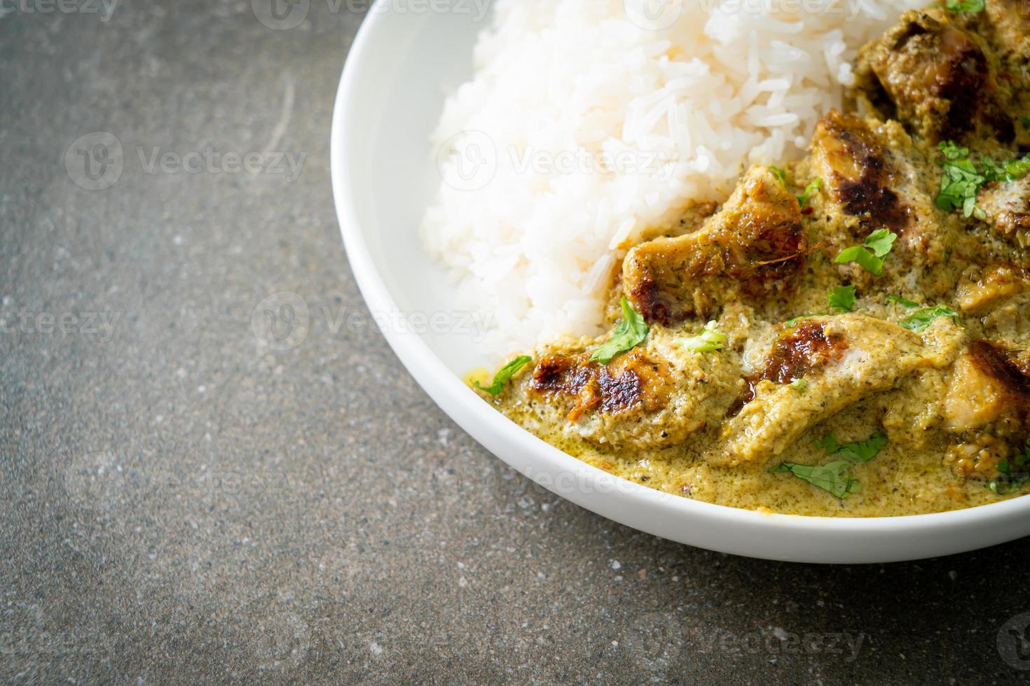 Afghani chicken in green curry or Hariyali tikka chicken hara masala with rice photo