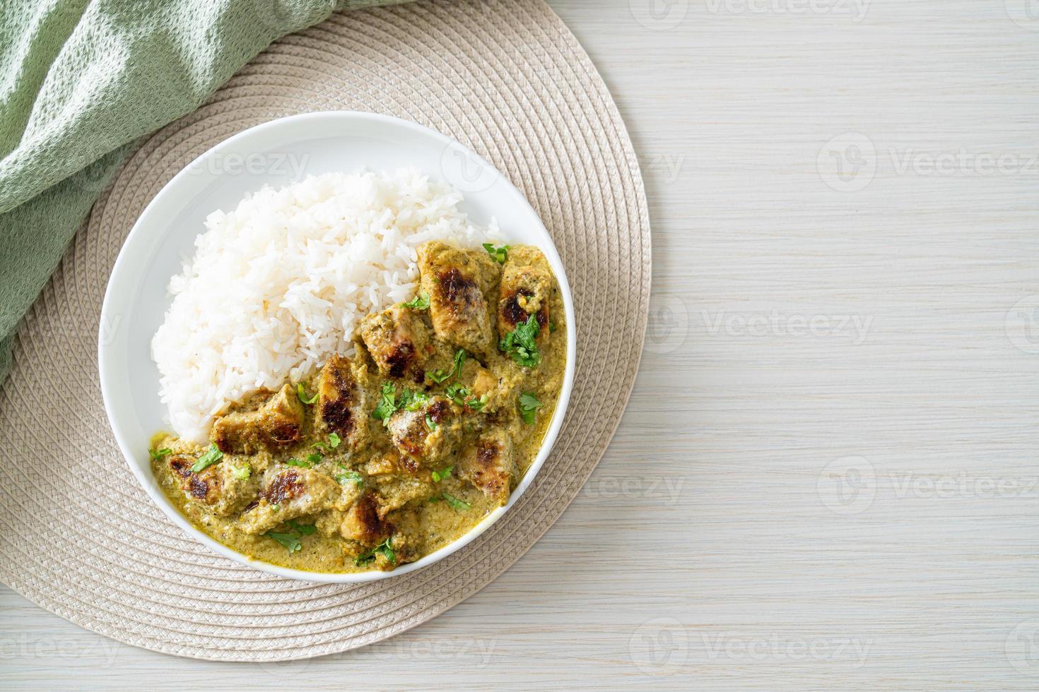 Afghani chicken in green curry or Hariyali tikka chicken hara masala with rice photo