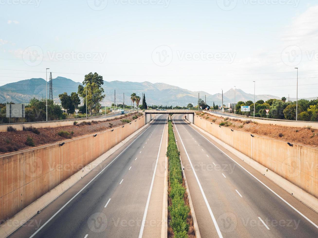 Empty multi-lane highway photographed from the bridge photo