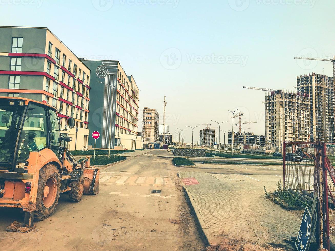 industrial site. construction of a large residential complex. life of people in multi-storey colored houses. uniform style of home decoration. concrete block houses photo