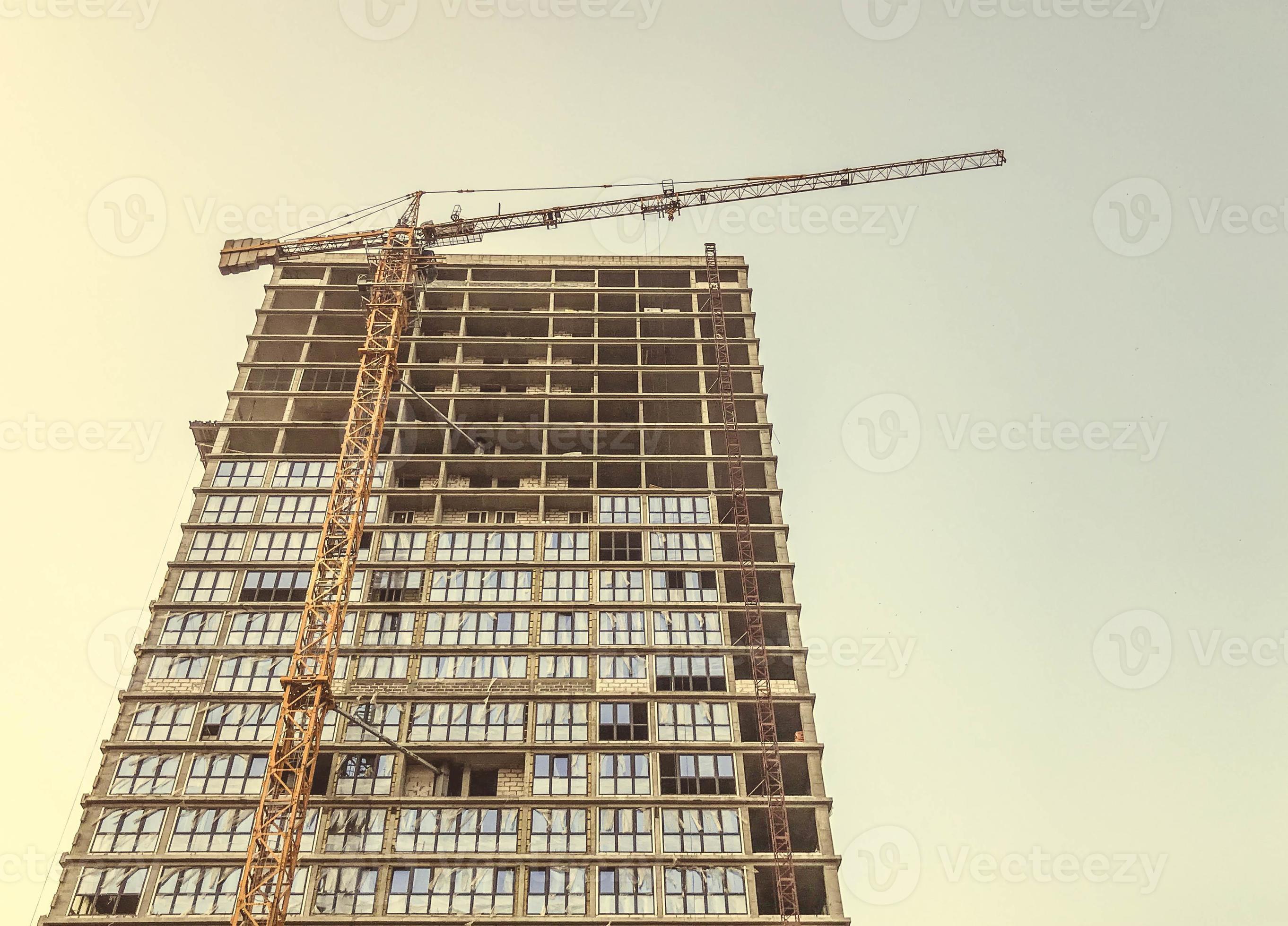 a tall glass house, partly without windows and doors. the house is