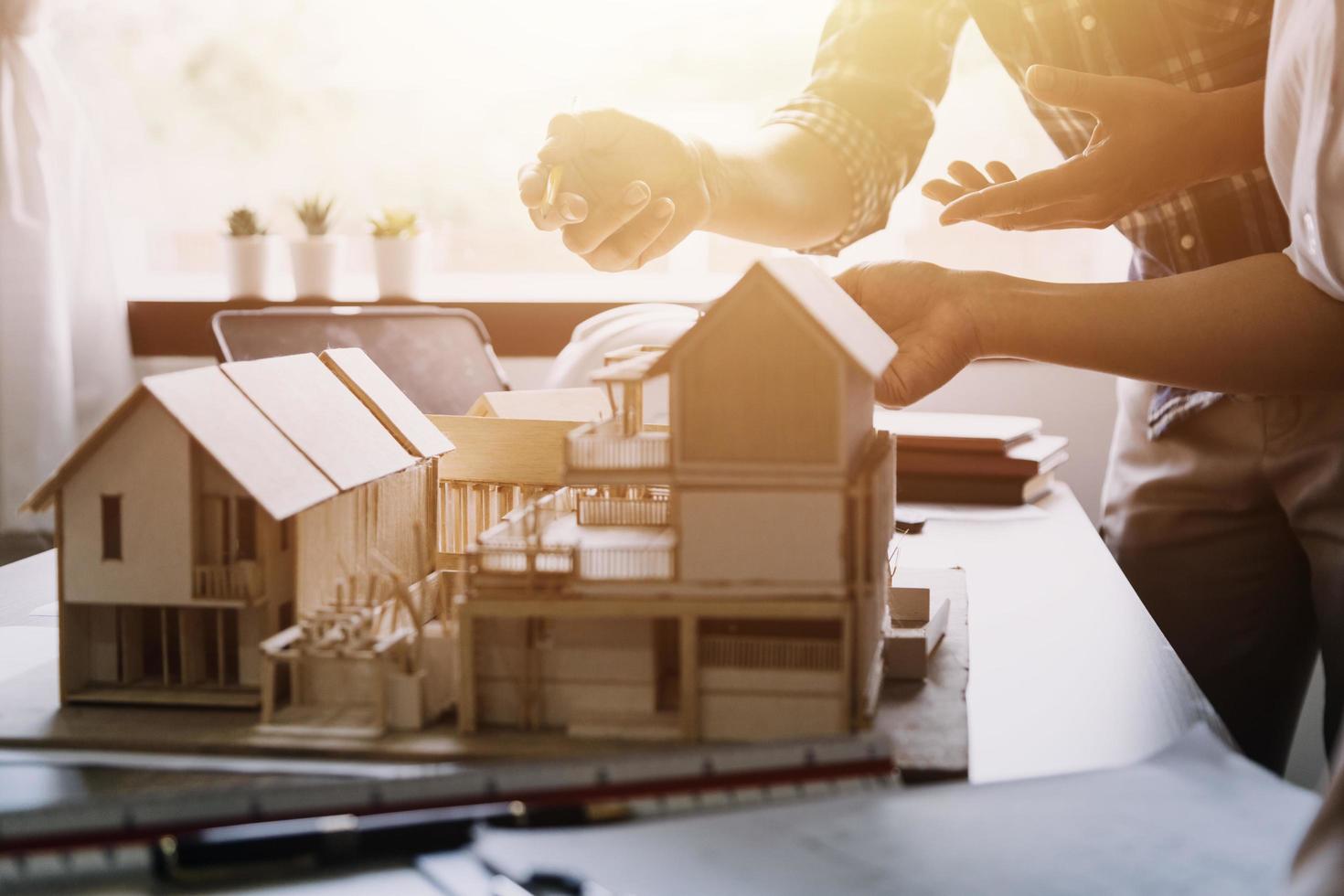 Construction engineer working at blueprint to build large commercial buildings in office. Engineering tools and construction concept. photo