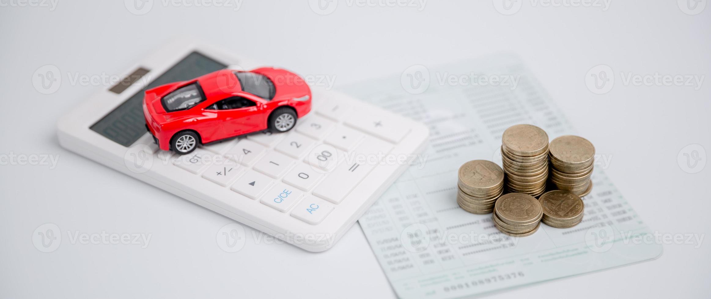 Concept of car insurance business, saving buy - sale with tax and loan for new car. Car toy vehicle with stack coin money on background. Planning to manage transportation finance costs. loan for car photo