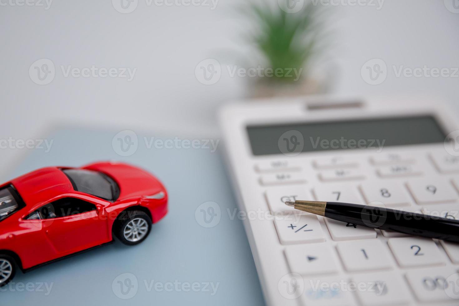 Concept of car insurance business, saving buy - sale with tax and loan for new car. Car toy vehicle with stack coin money on background. Planning to manage transportation finance costs. loan for car photo