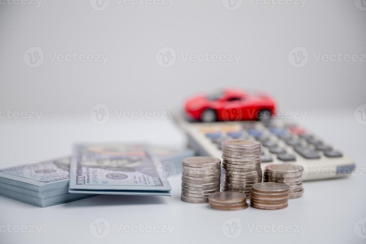 Concept of car insurance business, saving buy - sale with tax and loan for new car. Car toy vehicle with stack coin money on background. Planning to manage transportation finance costs. loan for car photo