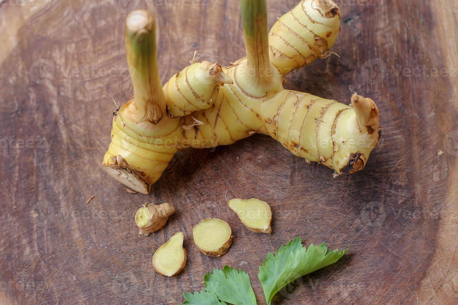 Galangal cut into thin strips with celery leaves. 13682620 Stock Photo