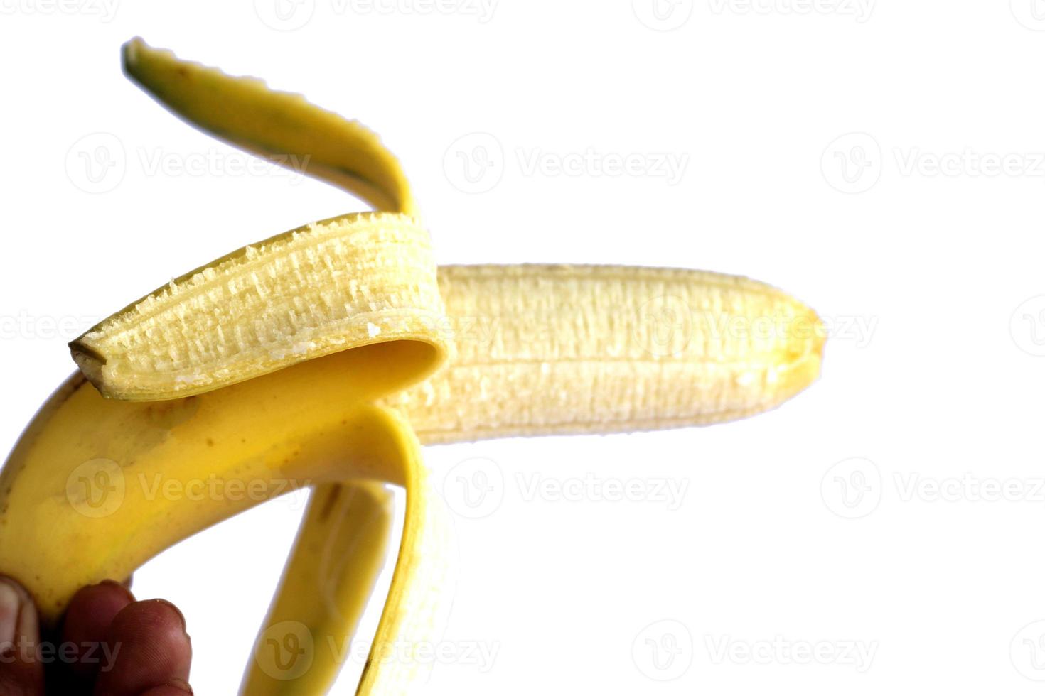 Peeled banana isolated on white background photo