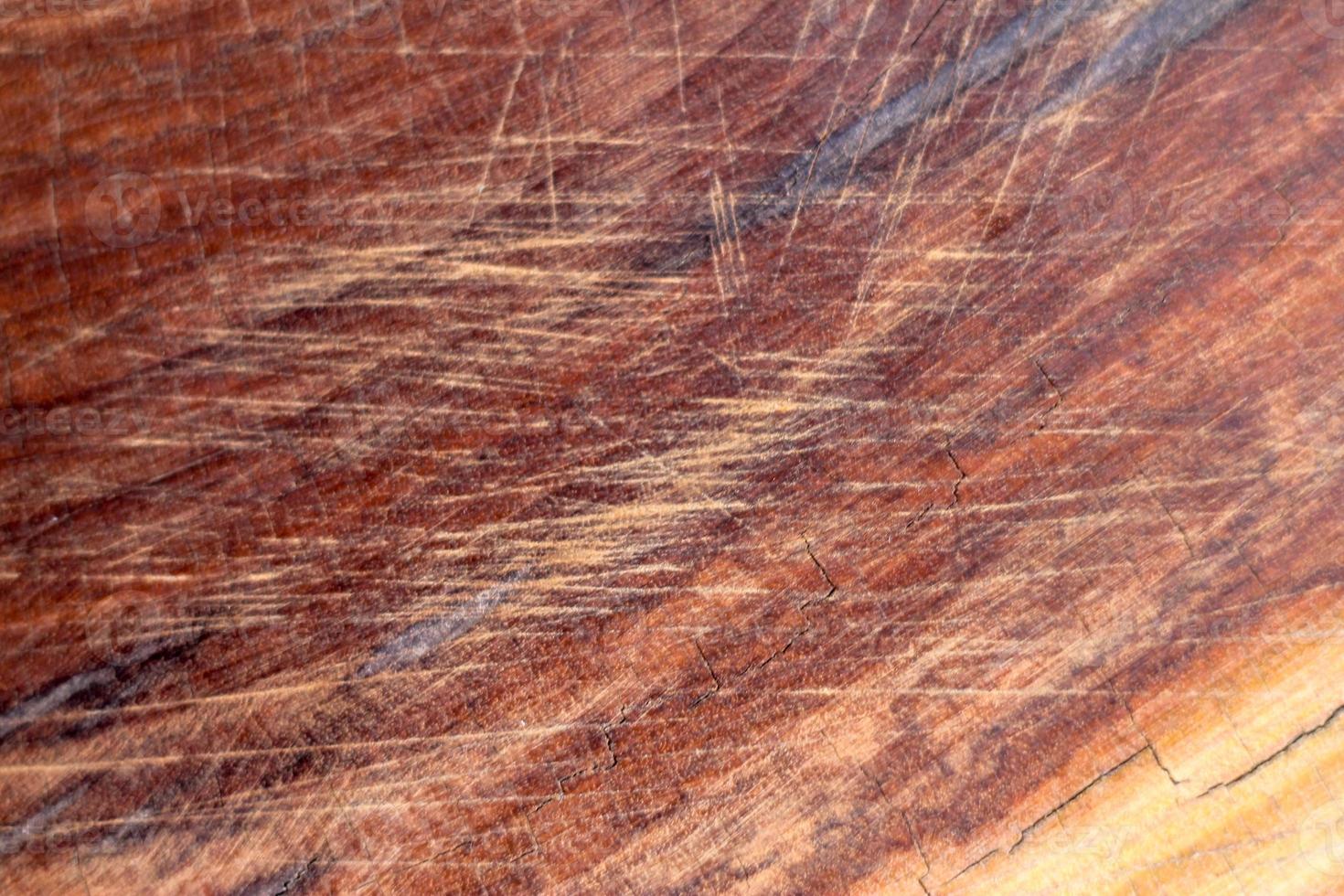 Brown scratched wooden cutting board. Wood texture photo