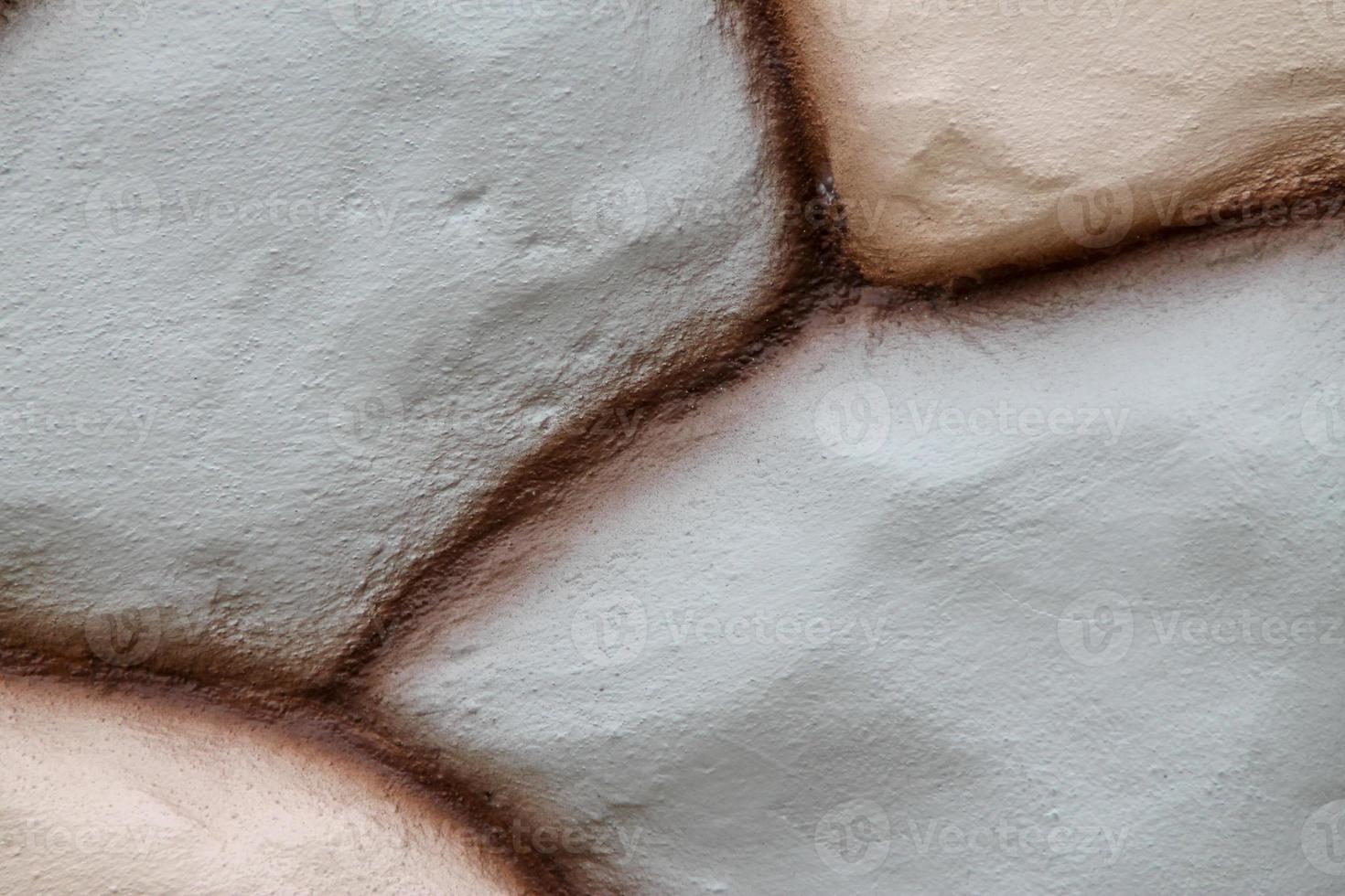 Stone wall texture in brown color and pink color use for background. photo