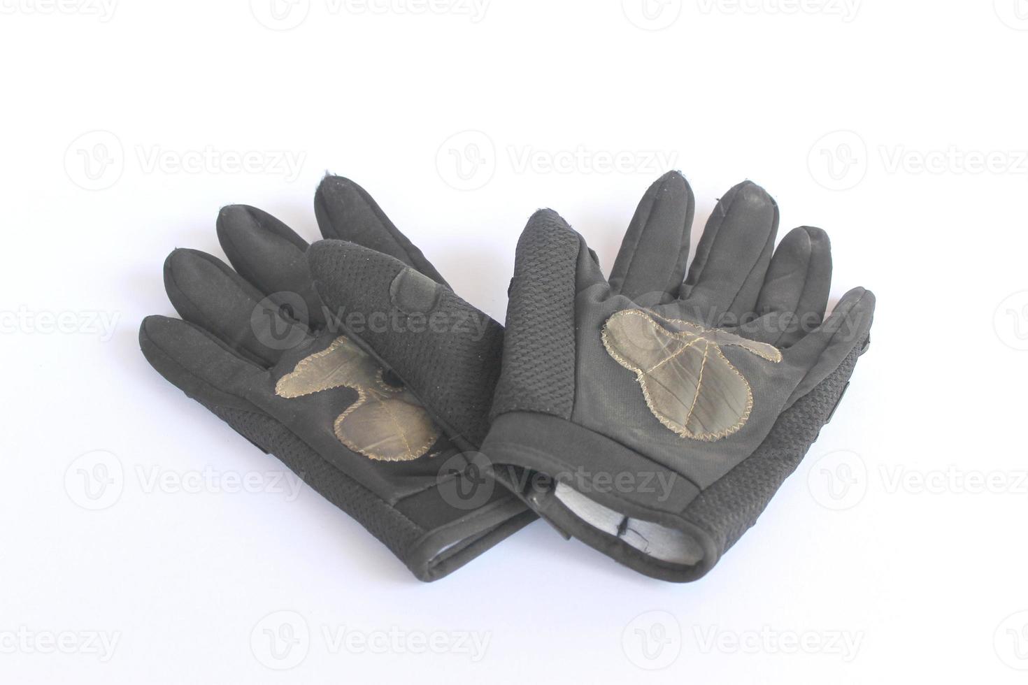 dirty old black gloves. photo