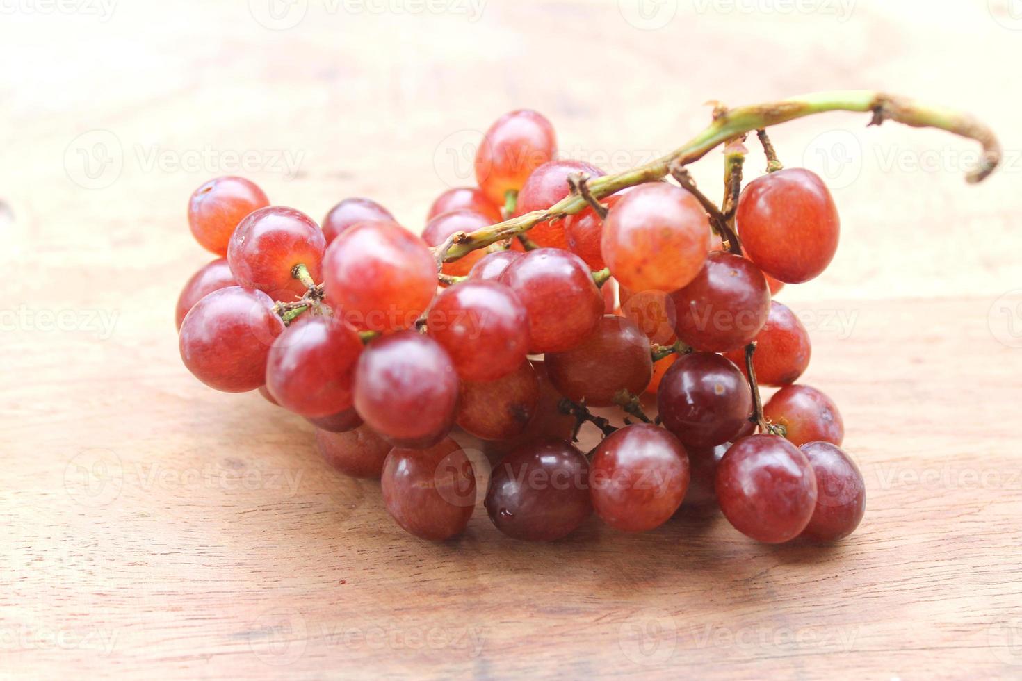 Grapes on a wooden table photo