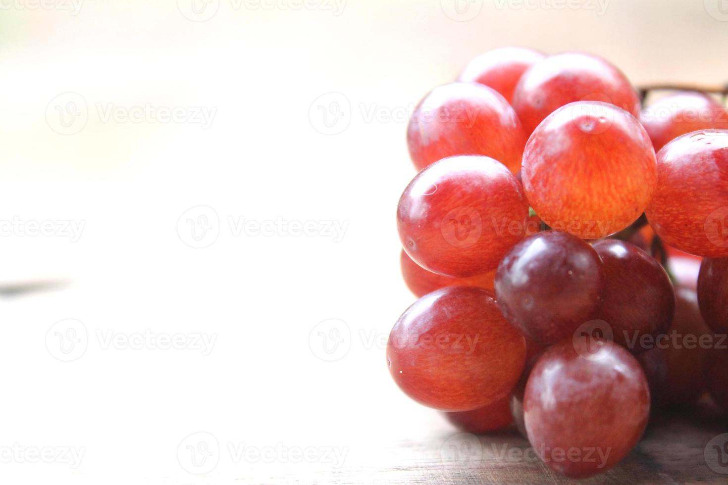 Grapes on a wooden table photo