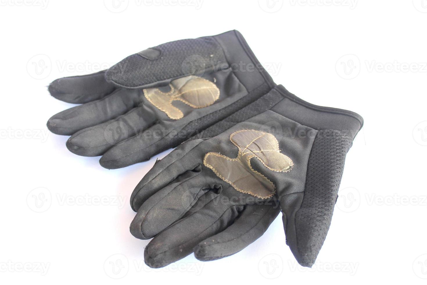 dirty old black gloves. photo