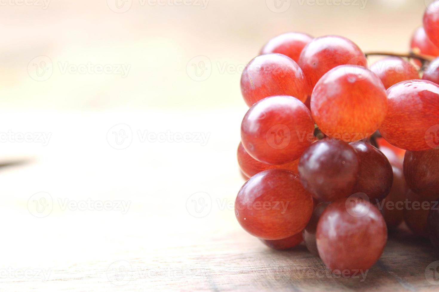 Grapes on a wooden table photo