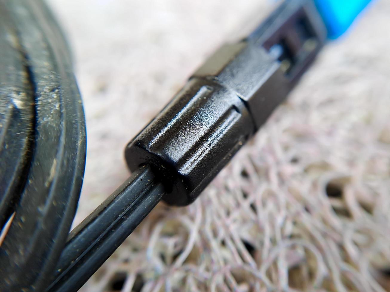 A used blue wifi cable that is no longer used because it's broken photo