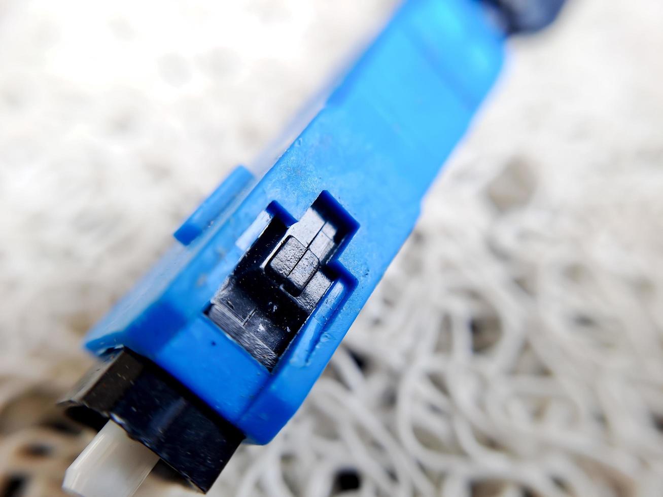 A used blue wifi cable that is no longer used because it's broken photo
