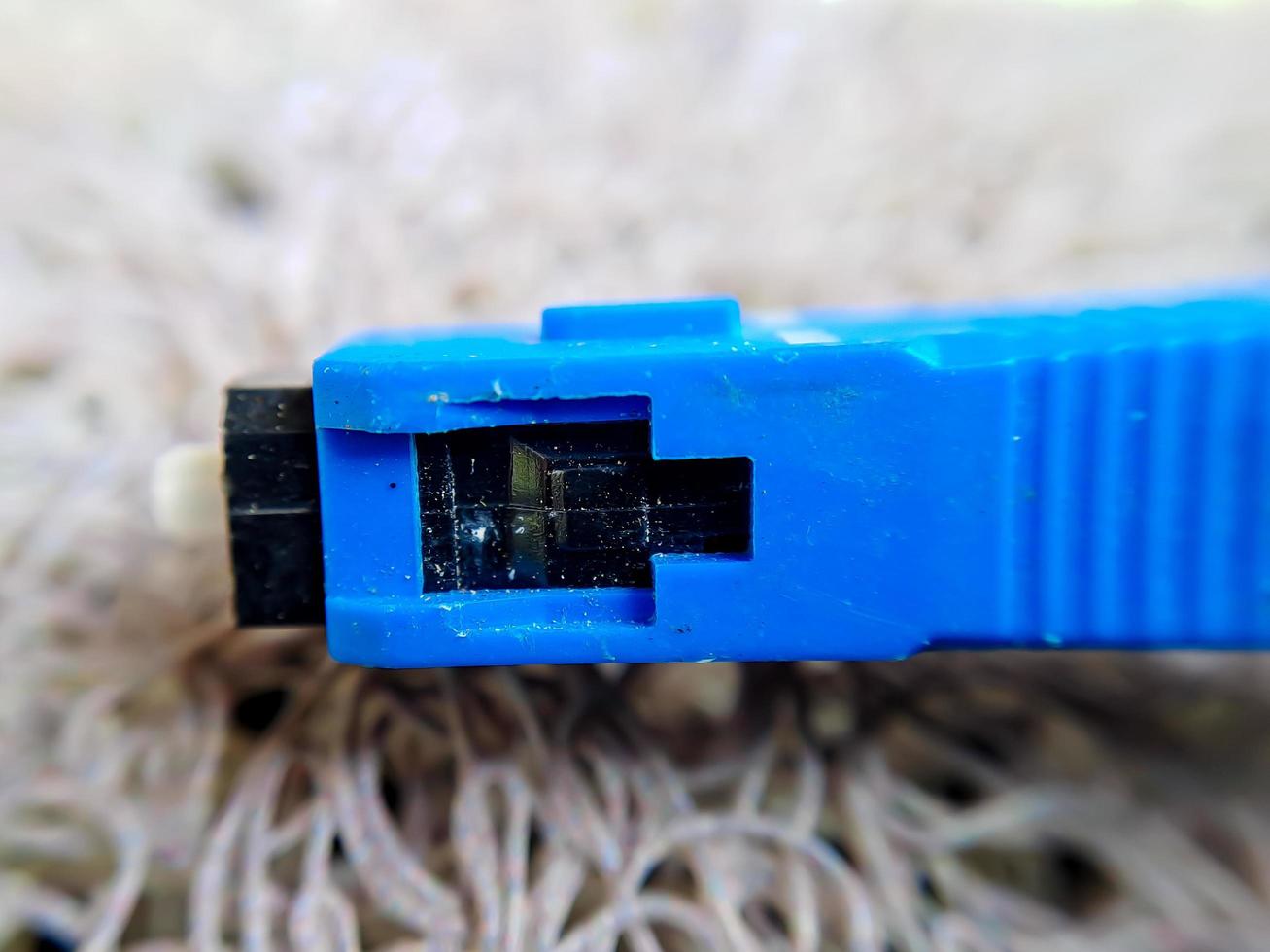 A used blue wifi cable that is no longer used because it's broken photo