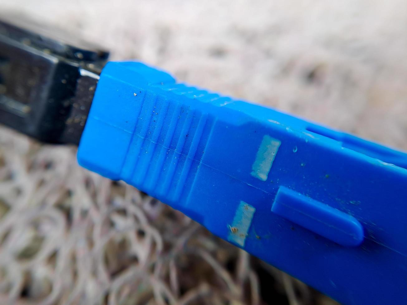 A used blue wifi cable that is no longer used because it's broken photo