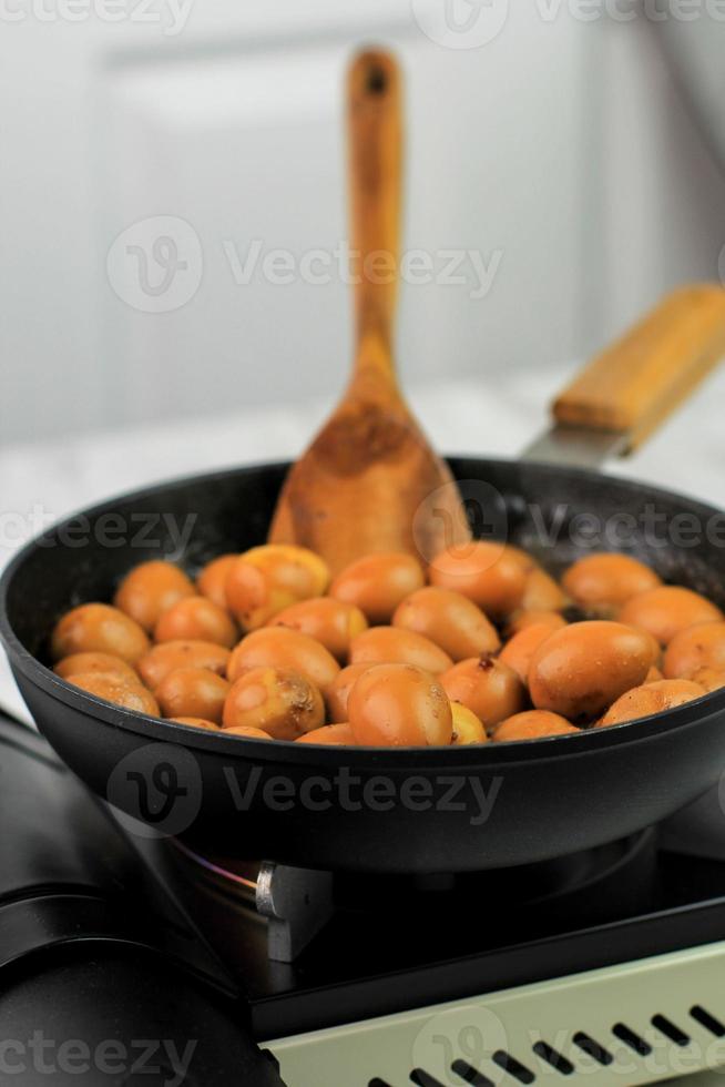 Close Up Semur Telur Puyuh  is Boiled Eggs Cook with Soy Sauce for Family Menu photo
