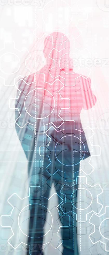 Vertical Panorama Banner. Double exposure gears mechanism on blurred background. Business and industrial process automation concept. photo