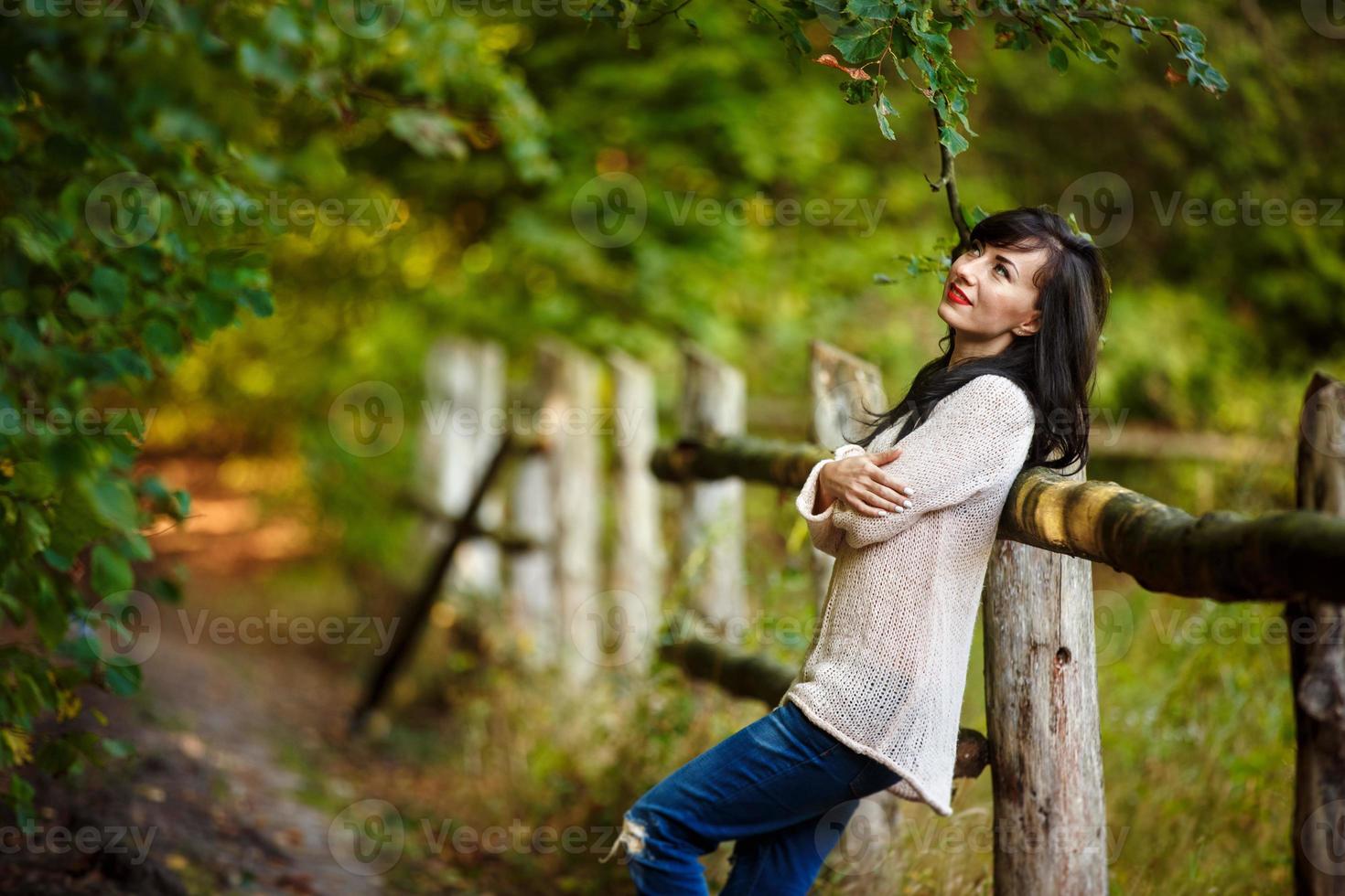 Young woman walking in the park, forest photo