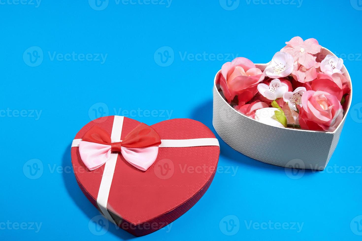 a postcard from a box in the shape of a heart and rosebuds.valentine's day concept photo