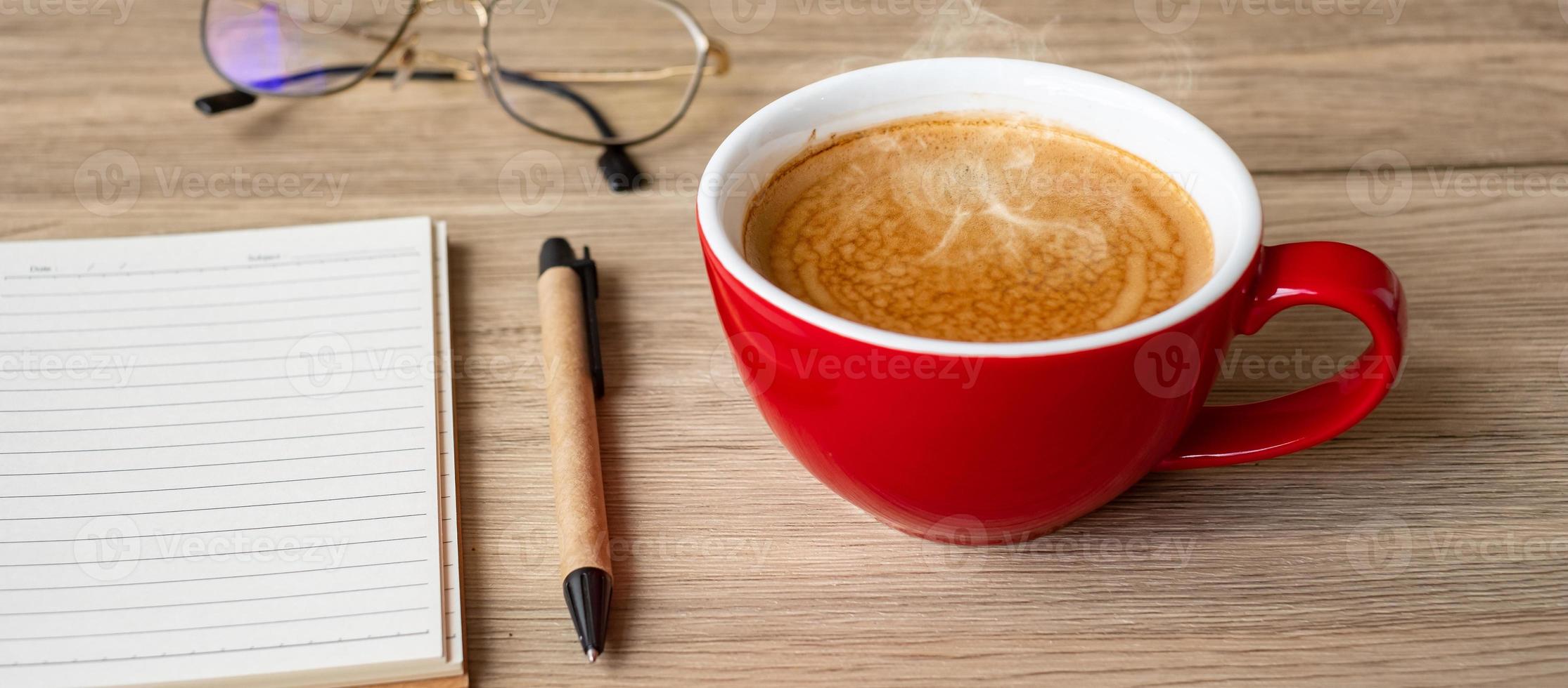blank notebook and coffee cup on wood table. Motivation, Resolution, To do list, Strategy and Plan concept photo