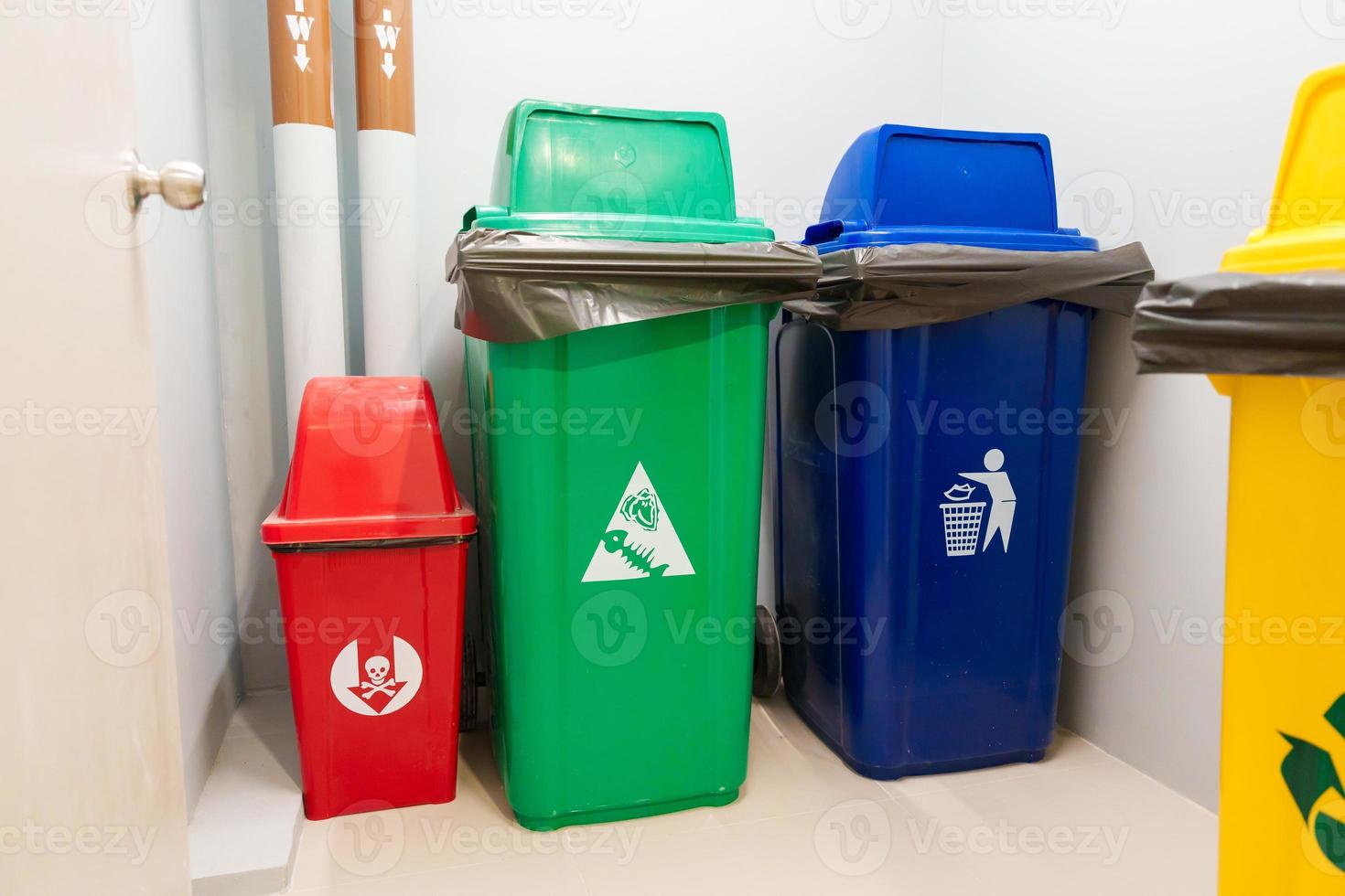 Colorful trash dustbin, Red, green, blue and yellow bin for Hazardous, Biodegradable, General and Recyclable waste. recycling management, waste segregation, garbage and rubbish concept photo