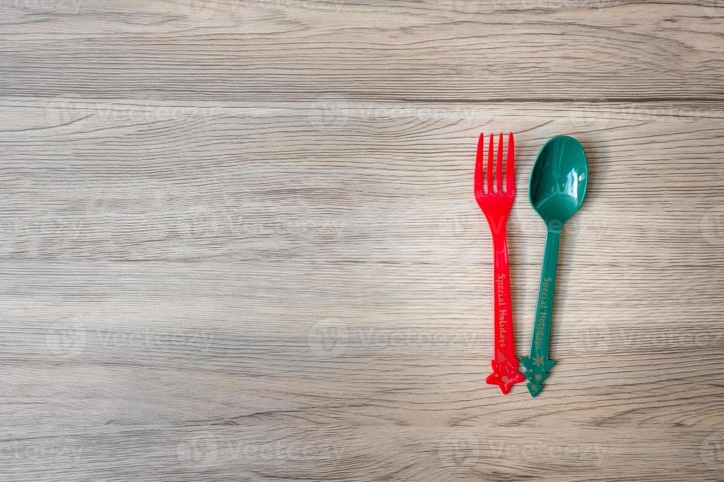 Merry Christmas with fork and spoon on wood table background. Xmas, party and happy New Year concept photo