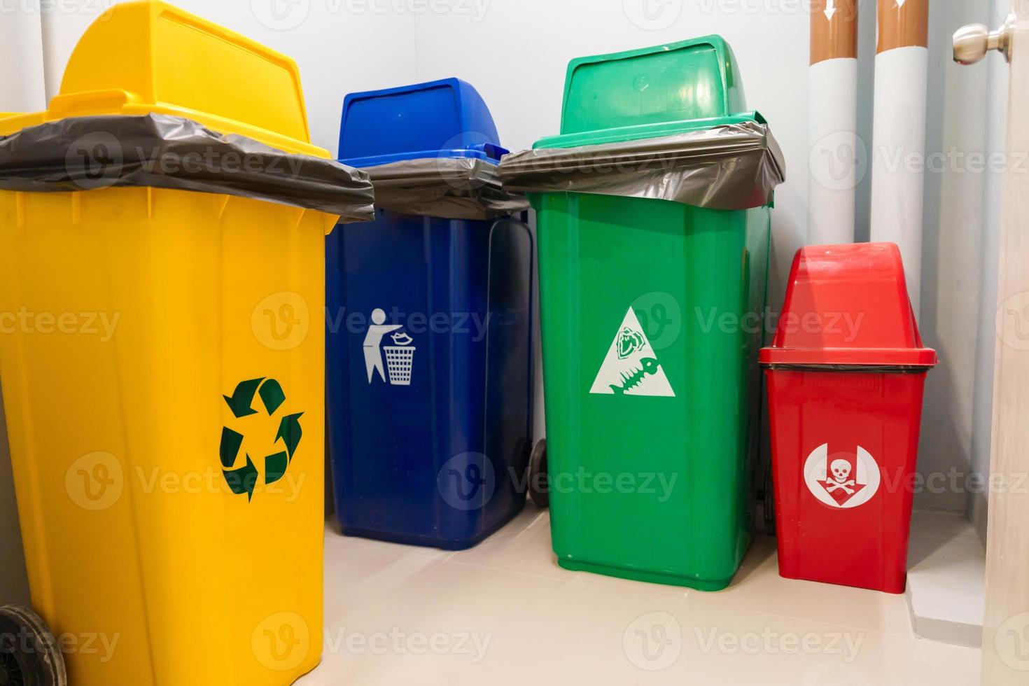 Colorful trash dustbin, Red, green, blue and yellow bin for Hazardous, Biodegradable, General and Recyclable waste. recycling management, waste segregation, garbage and rubbish concept photo