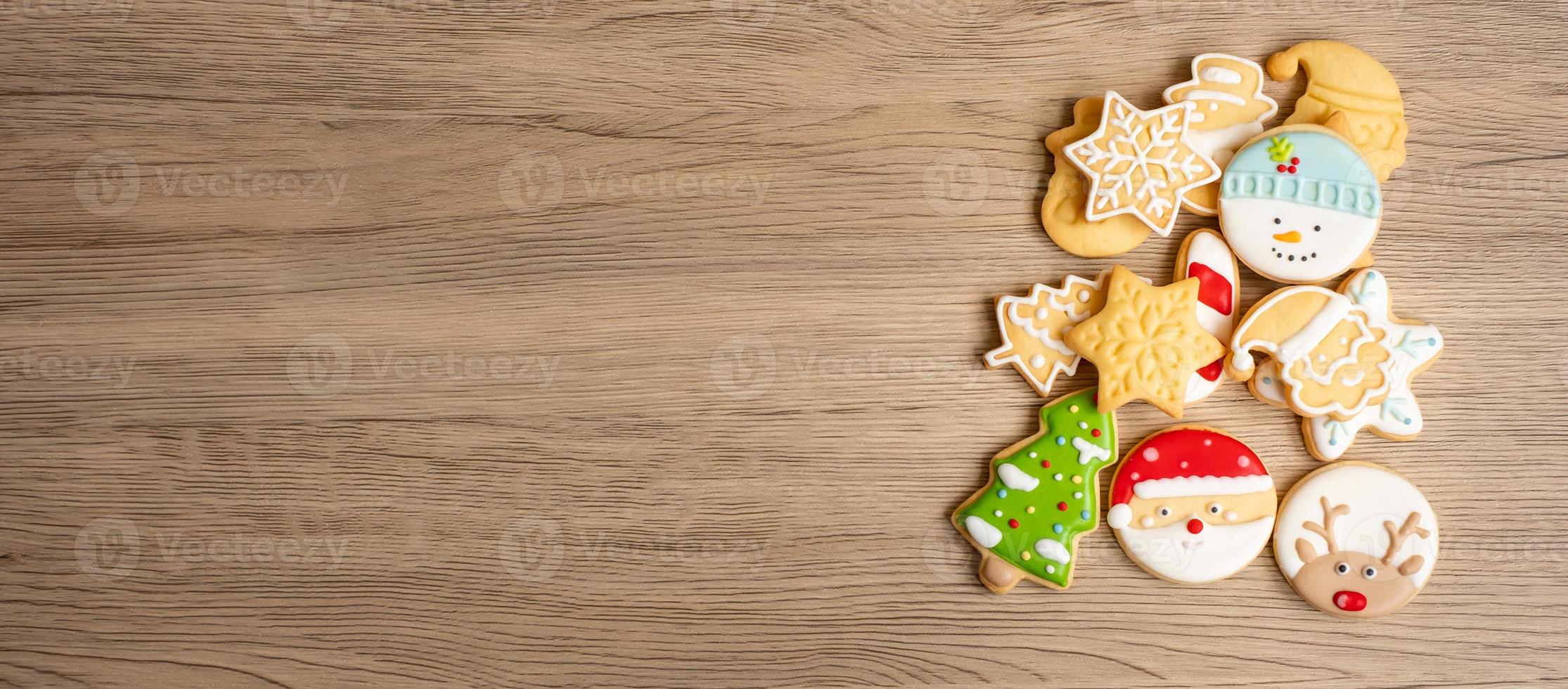 Merry Christmas with homemade cookies on wood table background. Xmas, party, holiday and happy New Year concept photo