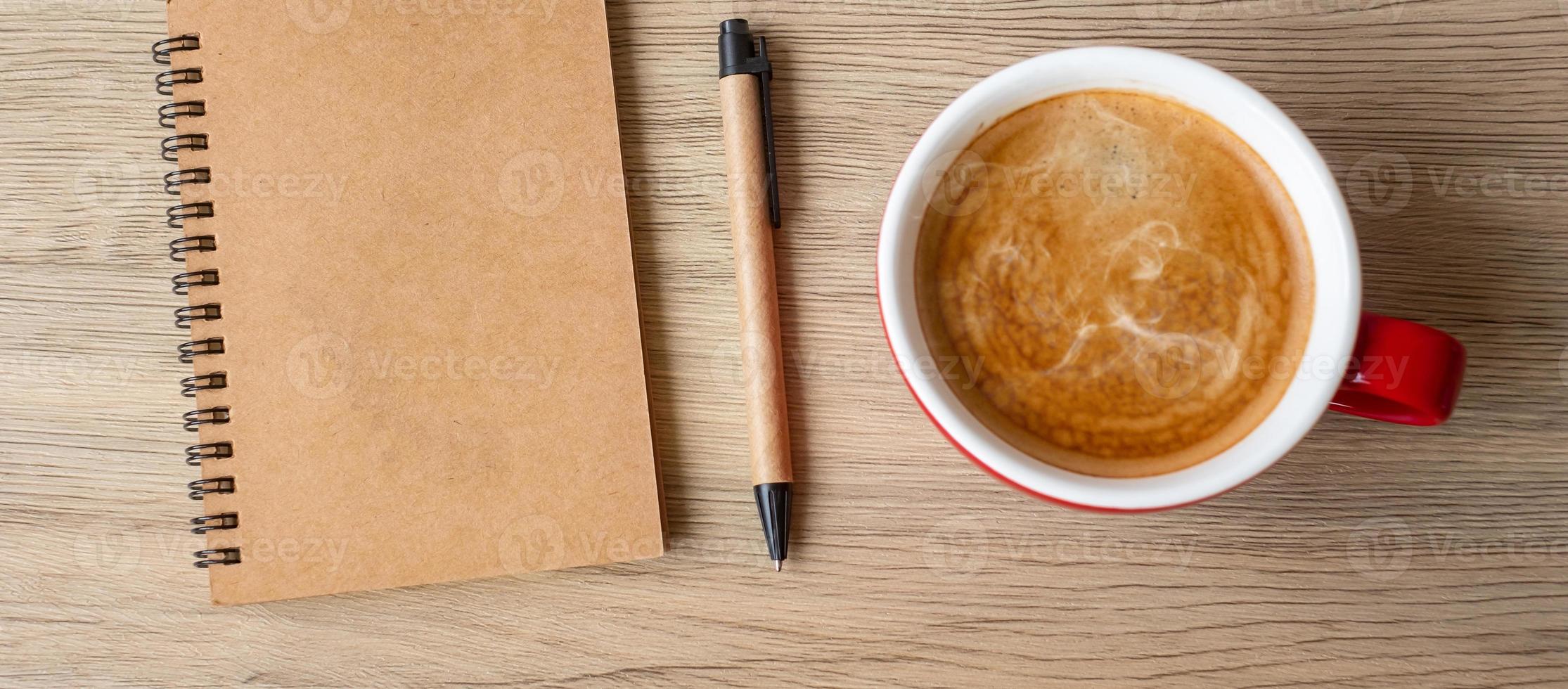 blank notebook and coffee cup on wood table. Motivation, Resolution, To do list, Strategy and Plan concept photo