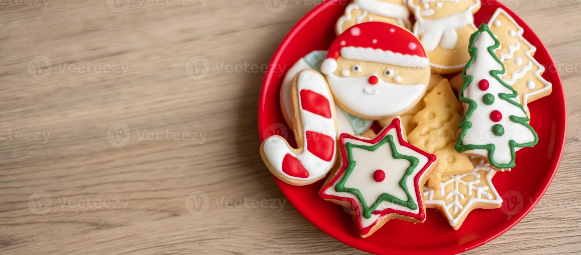 Merry Christmas with homemade cookies on wood table background. Xmas, party, holiday and happy New Year concept photo