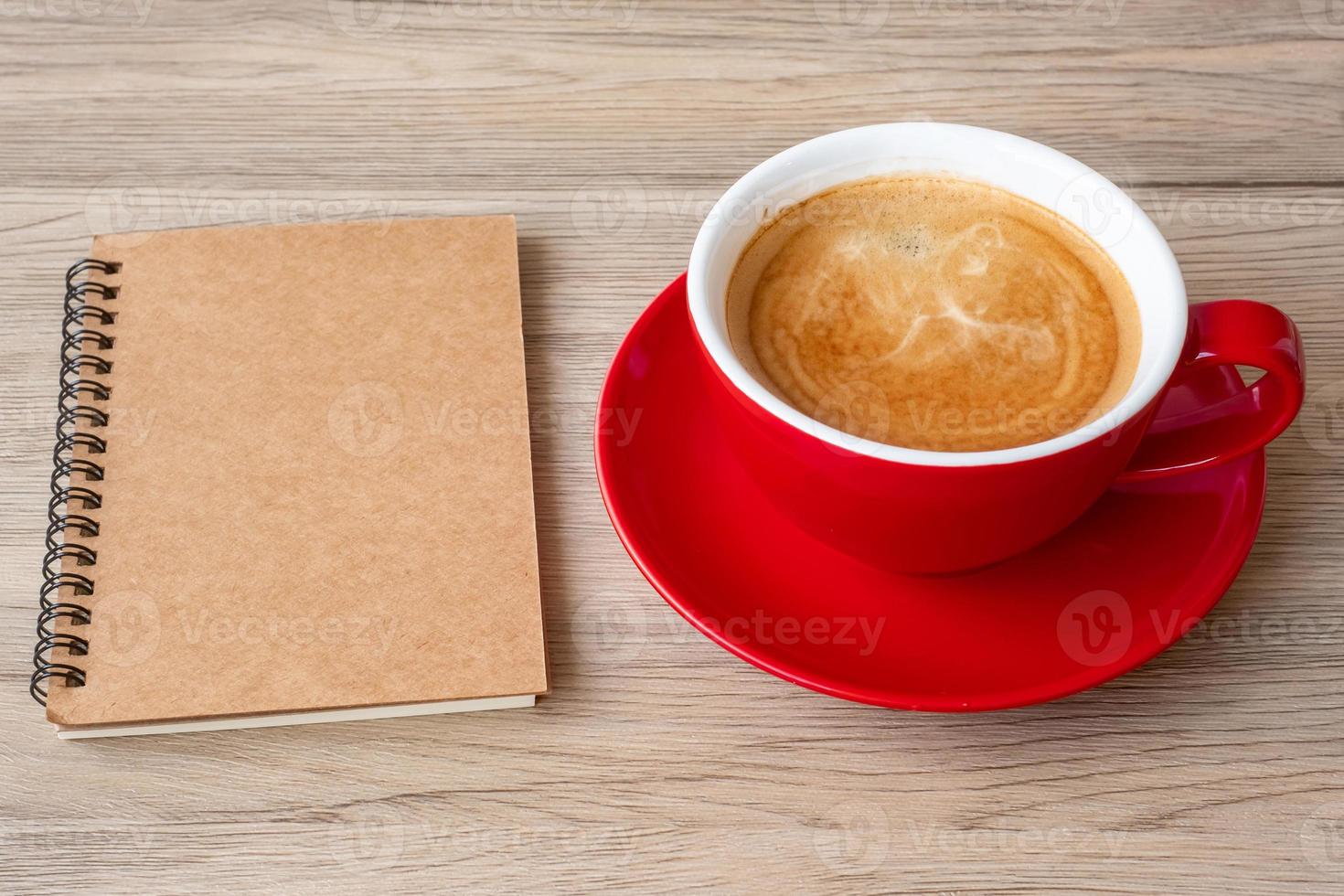 blank notebook and coffee cup on wood table. Motivation, Resolution, To do list, Strategy and Plan concept photo