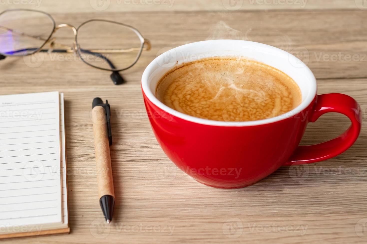 blank notebook and coffee cup on wood table. Motivation, Resolution, To do list, Strategy and Plan concept photo