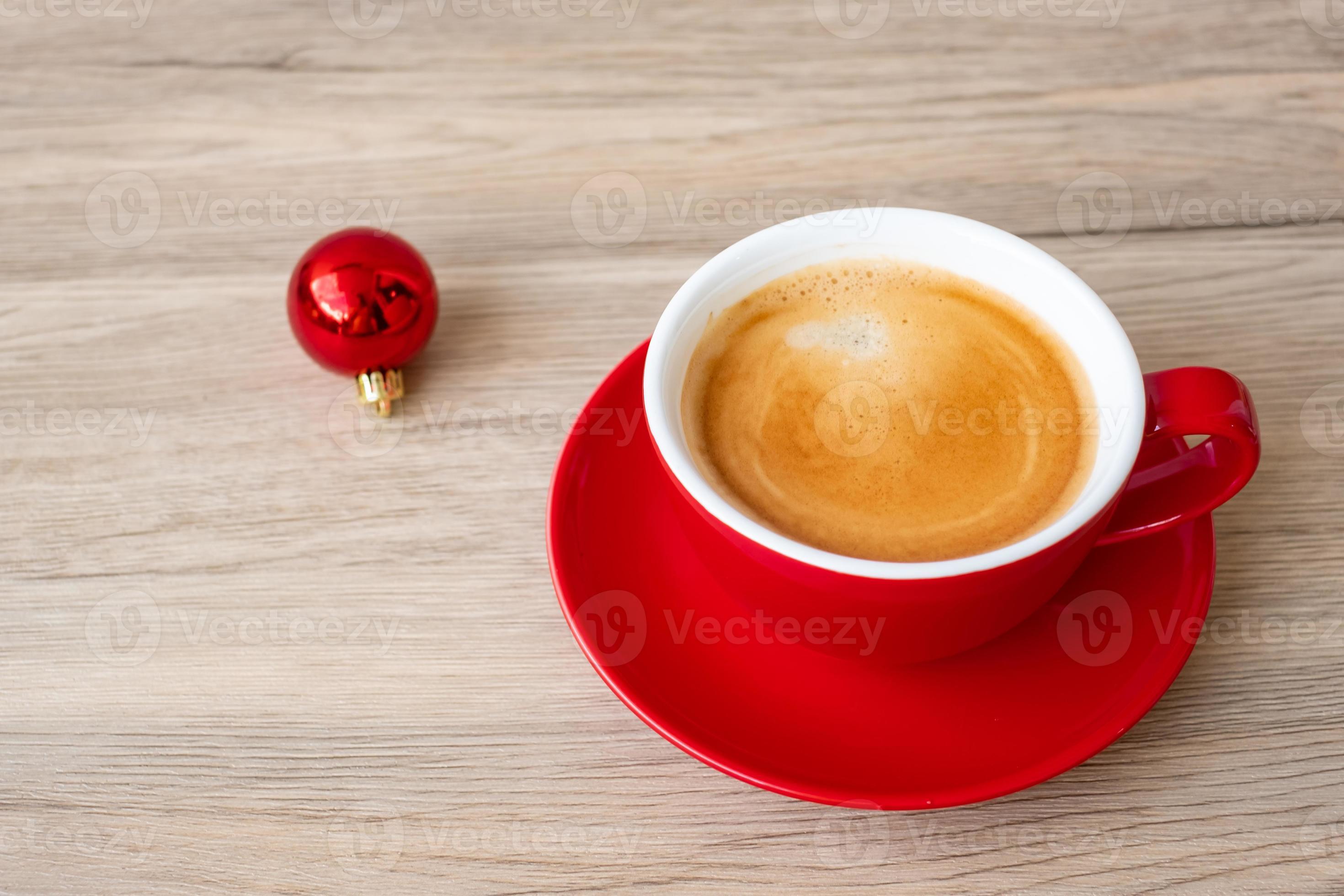 Hot espresso coffee on table, Red coffee cup in cafe or home.Top view