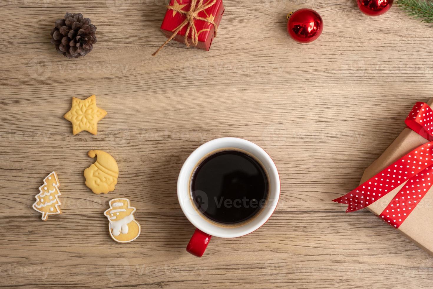 Merry Christmas with homemade cookies and coffee cup on wood table background. Xmas eve, party, holiday and happy New Year concept photo