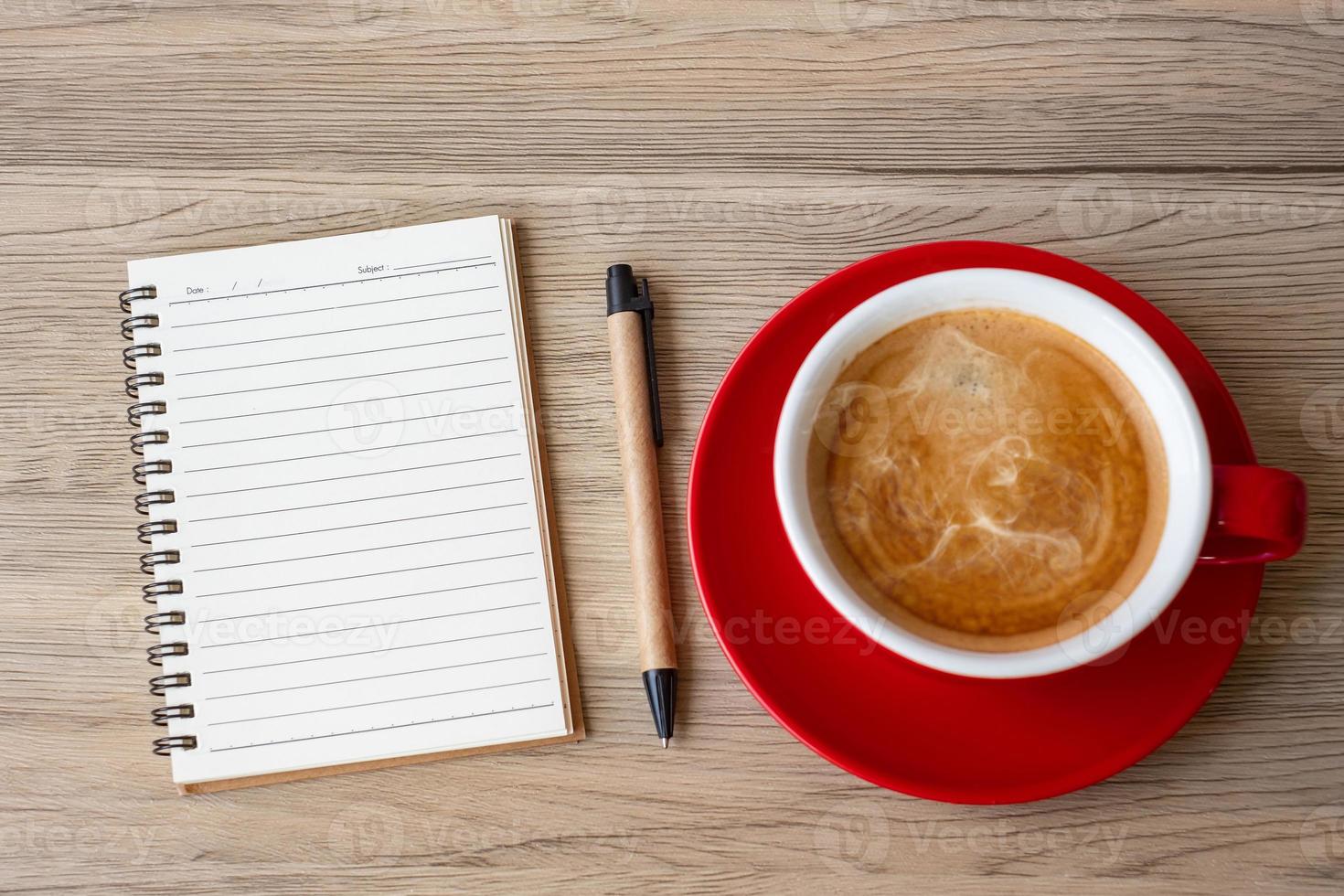 blank notebook and coffee cup on wood table. Motivation, Resolution, To do list, Strategy and Plan concept photo