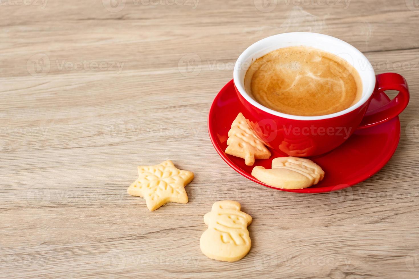 Merry Christmas with homemade cookies and coffee cup on wood table background. Xmas eve, party, holiday and happy New Year concept photo