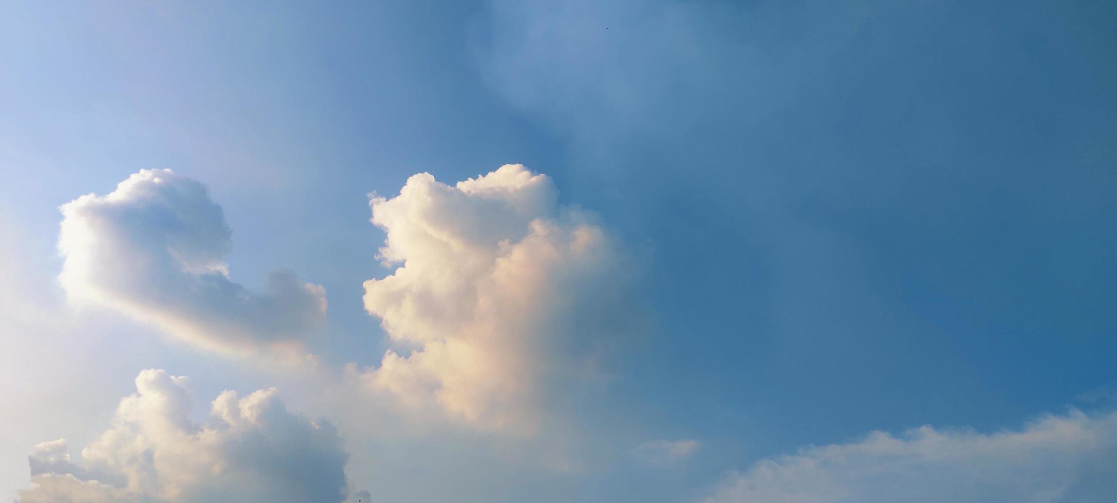 Blue color sky clear view background with cloud behind the Sun photo