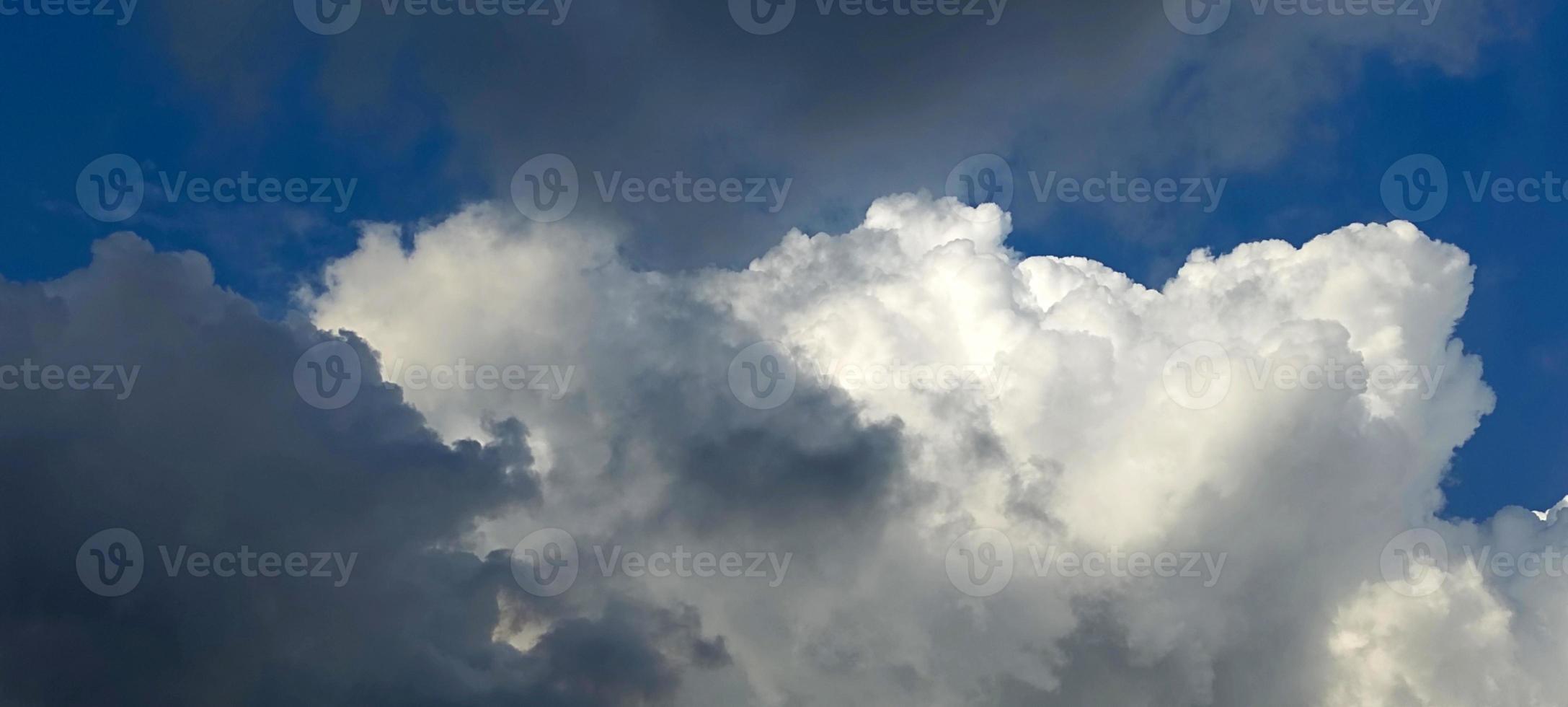 Blue color sky clear view background with cloud behind the Sun photo