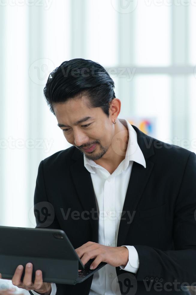 Portrait of an Asian businessman which is a new generation entrepreneur in the business photo